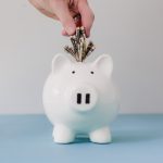 hand-putting-money-in-bank